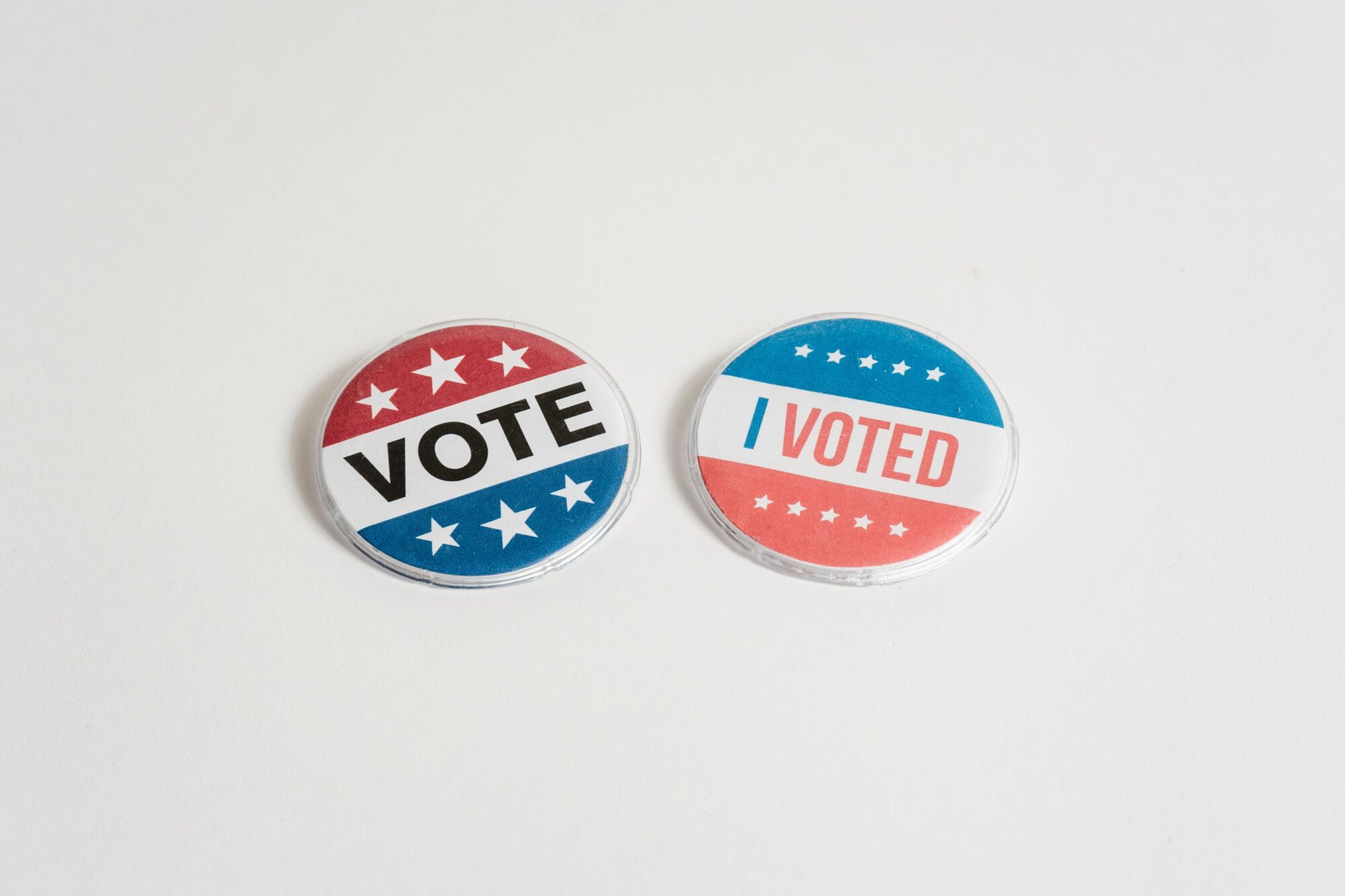 Vote and I Voted&quot; button pins on white background.